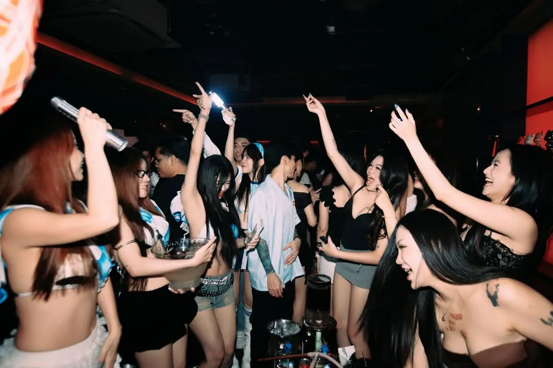 Crowd dancing at Neighborhood Club — house party night District 1 Saigon