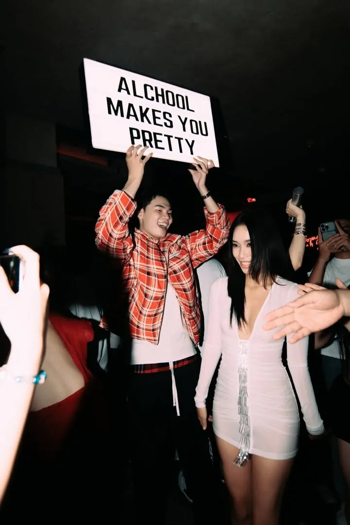 Light-box sign moment in the crowd at Neighborhood Club Saigon